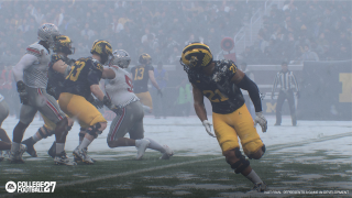 College Football 27 gameplay screenshot showing Michigan and Ohio State competing in a snow-covered stadium during winter conditions.