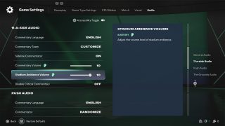 The 11-a-side audio settings in FC 27, with options for commentary language and team, and the 'Stadium Ambience Volume' slider set to maximum.