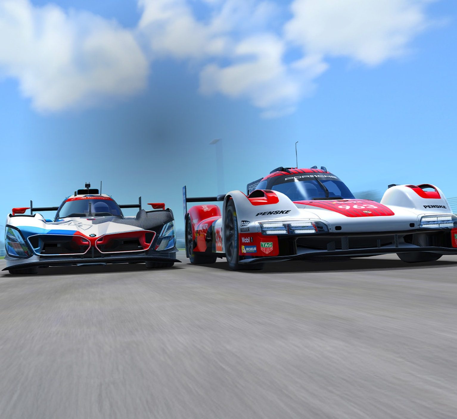 Two racing cars, one white with black and blue accents and the other white with red accents, speed side by side on a track under a clear blue sky.