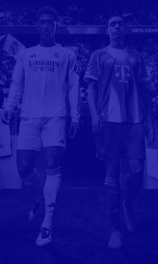 Two football players are surrounded by fans and security, entering a football pitch. A heavy blue is color overlaid on top.