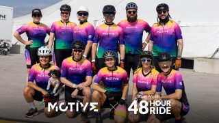 Motive employees pose in a photo for their 48 hour bicycle ride for the Make-A-Wish foundation.
