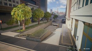 Office park stairways and ramps lined by trees, between two buildings. 