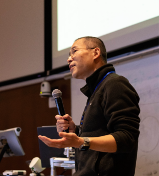 Jinsong Li delivering a keynote speech to open The University of British Columbia hackathon event