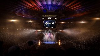 A packed Madison Square Garden arena hosts a UFC event, with bright lights, lasers, pyrotechnics, and a central octagon beneath a large scoreboard displaying EA Sports UFC 6.