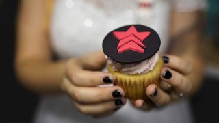 Nikki holding a Mass Effect cup cake